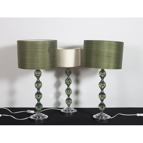 336 - A SET OF THREE CONTINENTAL WHITE METAL AND GLAZED TABLE LAMPS each with a knopped column above a cir... 