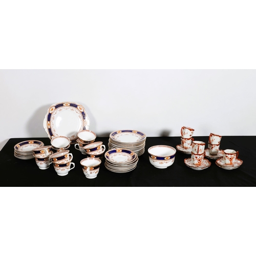 340 - A FORTY FOUR PIECE ROSLYN BONE CHINA TEASET the white ground with blue and gilt border with floral d... 