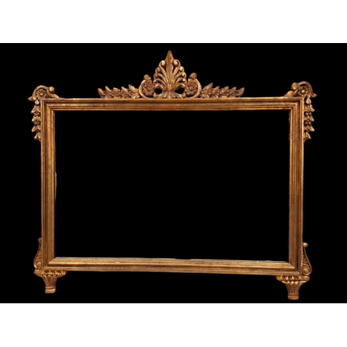 374 - A CONTINENTAL CARVED AND MOULDED FRAME MIRROR the rectangular plate within a moulded frame with pier... 