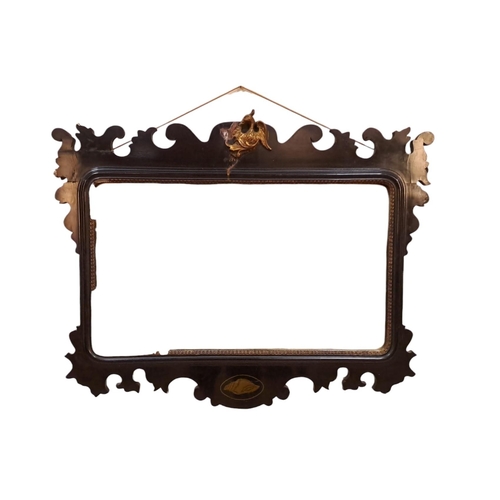 381 - A VINTAGE STAINED WOOD AND GILT FRET FRAME MIRROR the bevelled glass plate within a gilt slip ho-ho ... 