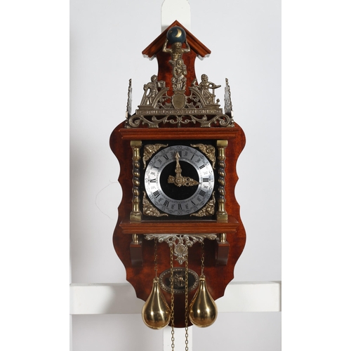 386 - A DUTCH STYLE MAHOGANY AND GILT BRASS WALL CLOCK the shaped case with figural cresting above a silve... 