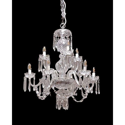 404 - A WATERFORD CUT GLASS NINE BRANCH CHANDELIER hung with faceted chains and pendent drops 
80cm drop