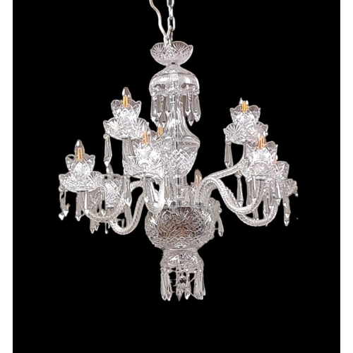 406 - A TARA CRYSTAL NINE BRANCH CHANDELIER with scroll arms and drip pans hung with faceted pendants 
70c... 