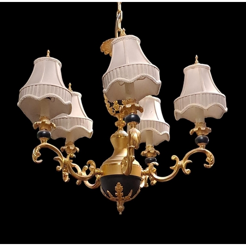 415 - A CONTINENTAL GILT METAL CHANDELIER the baluster column issuing five foliate cast scroll arms with s... 