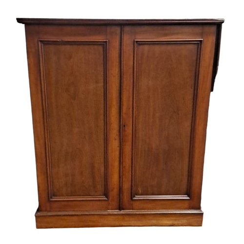 420 - A 19TH CENTURY MAHOGANY LINEN CUPBOARD of rectangular outline the shaped top with panel doors contai... 