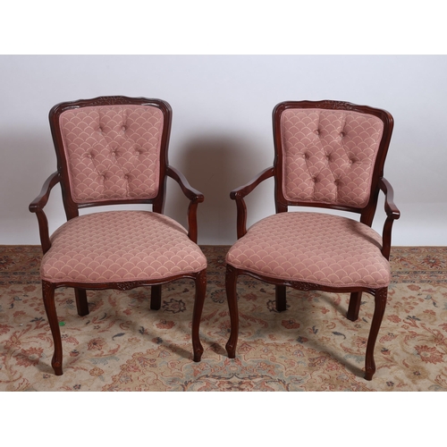 423 - A PAIR OF CONTINENTAL STAINED BEECHWOOD AND UPHOLSTERED ARMCHAIRS each with a foliate moulded top ra... 