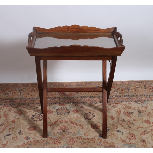 424 - A TEAK SERVING TRAY on folding stand the rectangular tray with pie crust gallery with carrying handl... 