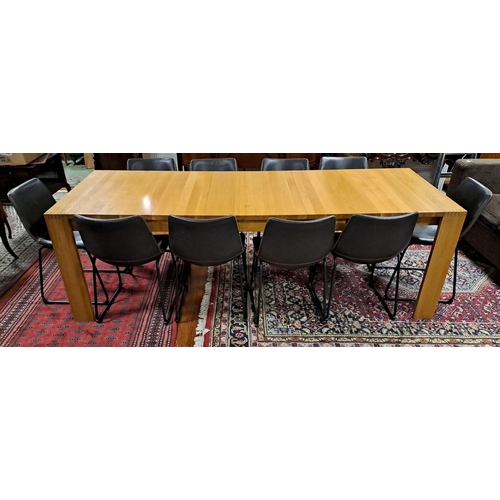 428 - AN ELEVEN PIECE DESIGNER DINING ROOM SUITE comprising ten hide upholstered and tubular dining chairs... 