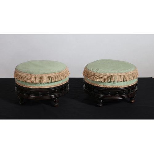 437 - A PAIR OF EDWARDIAN MAHOGANY AND UPHOLSTERED STOOLS of circular outline the upholstered seat raised ... 