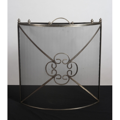 438 - A WHITE METAL AND MESH FIRESCREEN of demi lune outline with scroll decoration 
64cm (h) x 60cm (w) x... 