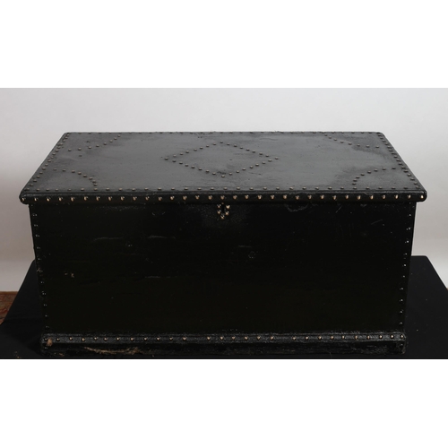 443 - A VINTAGE PINE AND CANVAS UPHOLSTERED TRUNK of rectangular outline the hinged lid with brass studs a... 