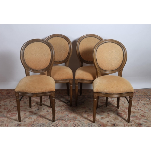 446 - A SET OF FOUR CONTINENTAL STAINED BEECHWOOD AND UPHOLSTERED DINING CHAIRS each with an oval back wit... 