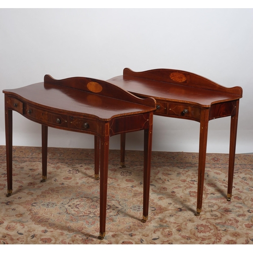 448 - A PAIR OF SHERATON DESIGN MAHOGANY AND SATINWOOD INLAID SIDE TABLES each of serpentine outline the s... 