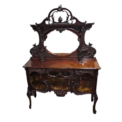 457 - AN EDWARDIAN CARVED MAHOGANY SIDE CABINET the superstructure with pierced C-scroll and foliate carvi... 