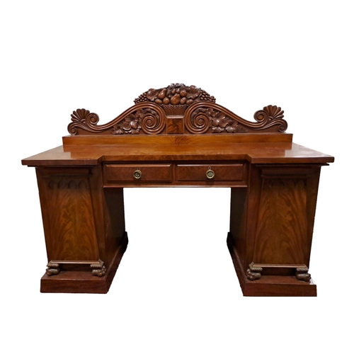 458 - A 19TH CENTURY MAHOGANY SIDEBOARD of inverted breakfront outline the shaped top with carved back abo... 