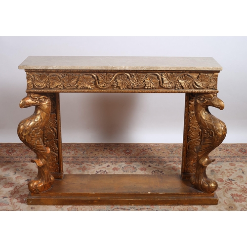 460 - A CONTINENTAL CARVED GILTWOOD AND MARBLE CONSOLE TABLE of rectangular outline surmounted by a veined... 