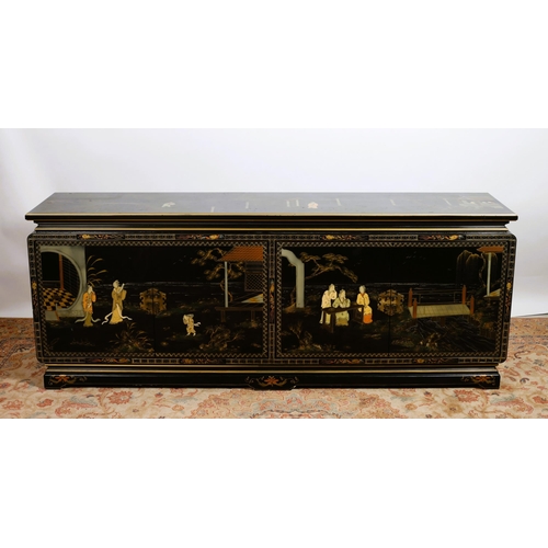 461 - A CHINESE BLACK LACQUERED AND POLYCHROME SIDE CABINET of rectangular outline the shaped top above fo... 