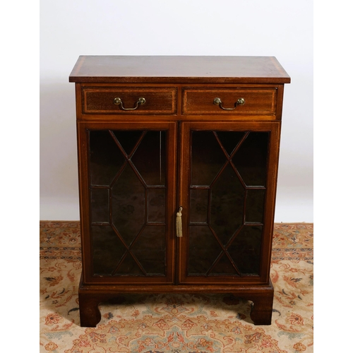 463 - A SHERATON DESIGN MAHOGANY AND SATINWOOD CROSSBANDED SIDE CABINET of rectangular outline the shaped ... 