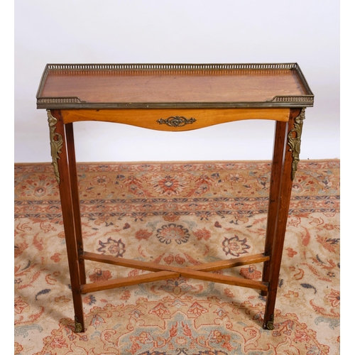 466 - A CONTINENTAL MAHOGANY AND GILT BRASS MOUNTED OCCASIONAL TABLE of rectangular outline the shaped top... 