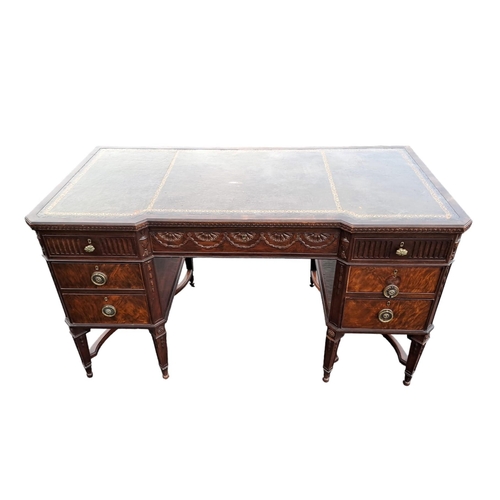 469 - A HEPPLEWHITE STYLE MAHOGANY DESK of inverted breakfront outline the shaped top with a tooled leathe... 