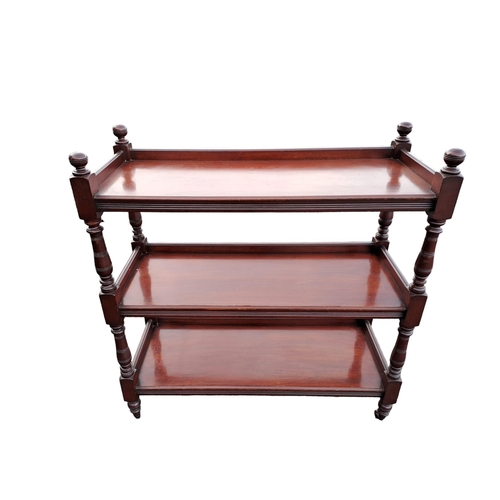 470 - AN EDWARDIAN MAHOGANY THREE TIER DUMBWAITER of rectangular outline with moulded three quarter galler... 