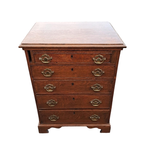 471 - A GEORGIAN STYLE OAK CHEST of rectangular outline the shaped top with five long graduated drawers wi... 