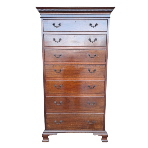 478 - A CHIPPENDALE STYLE MAHOGANY TALLBOY of rectangular outline the dentil moulded cornice above seven l... 