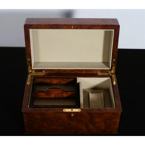 520 - A SIMULATED BURR WALNUT JEWELLERY CASKET the rectangular hinged top with removable trays and compart... 