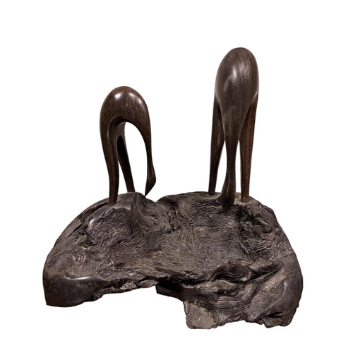 523A - GREY HERONS SCULPTURE 
In bog oak 
The Celtic Roots Studio 
30cm (h) x 32cm (w) x 27cm (d)