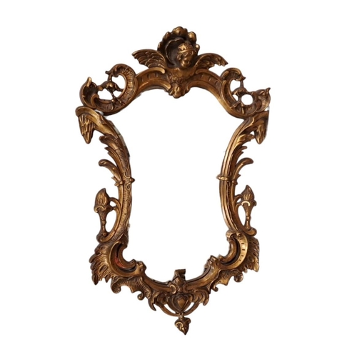 605 - A CONTINENTAL GILT FRAME MIRROR the shaped bevelled glass plate within a foliate moulded frame with ... 