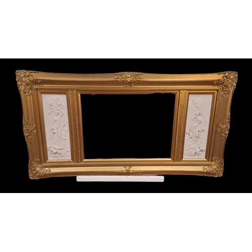 607 - A CONTINENTAL GILT FRAME COMPARTMENTED MIRROR the rectangular bevelled glass plate flanked on each s... 