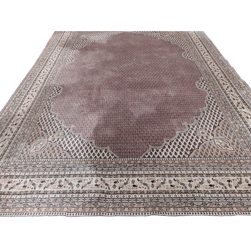 625 - A SAROUK MIR WOOL RUG the light pink and beige ground with central floral panel filled with stylised... 