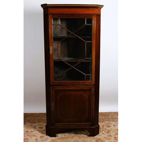 66 - A 19TH CENTURY MAHOGANY AND SATINWOOD INLAID CORNER CABINET the moulded cornice above an astragal gl... 