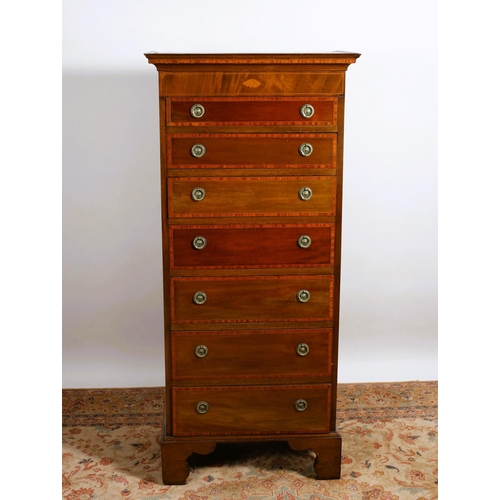 73 - AN EDWARDIAN MAHOGANY AND SATINWOOD CROSSBANDED TALLBOY of rectangular outline the shaped top above ... 