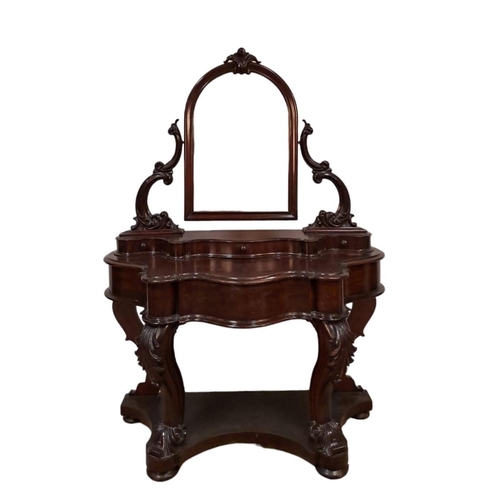 74 - A 19TH CENTURY MAHOGANY DRESSING TABLE the superstructure with swivel mirror raised on foliate scrol... 