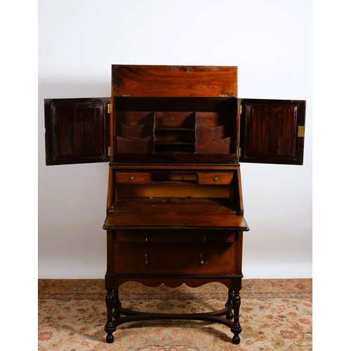 75 - A VINTAGE MAHOGANY INLAID BUREAU the superstructure with cupboards containing stationery compartment... 