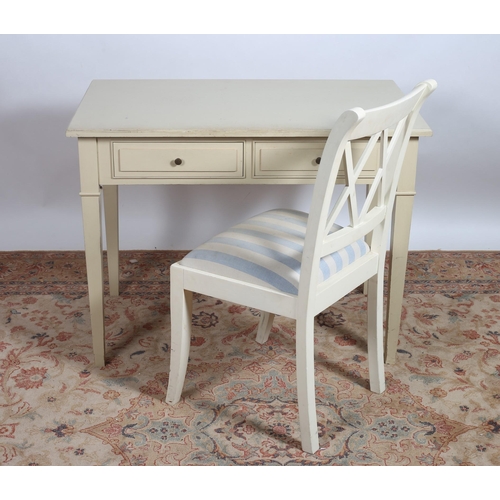 761 - A CREAM PAINTED SIDE TABLE of rectangular outline the shaped top with two frieze drawers on square t... 