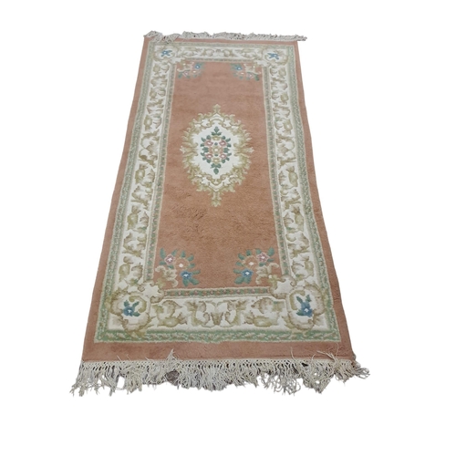 798 - THREE CHINESE WOOL RUGS the white ground with central floral panel within a conforming border 
198cm... 