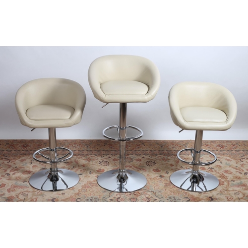 80 - THREE CHROME AND UPHOLSTERED ADJUSTABLE SWIVEL HIGH STOOLS raised on a circular spreading foot