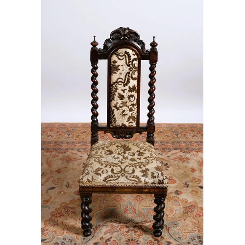 83 - A 19TH CENTURY MAHOGANY CHILD'S CHAIR the foliate carved top rail above an upholstered panel and sea... 