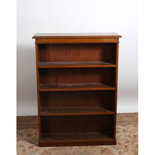 85 - AN EDWARDIAN MAHOGANY OPEN FRONT BOOKCASE of rectangular form the shaped top above four open shelves... 