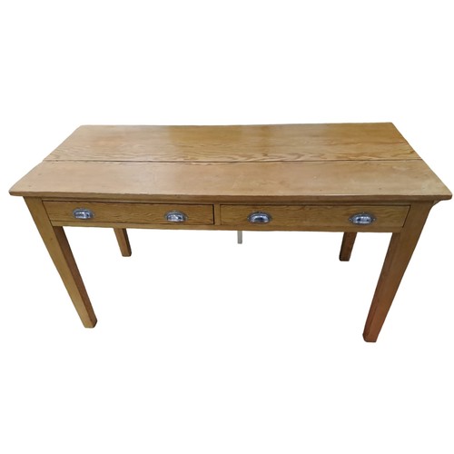 804 - A VINTAGE PINE TABLE of rectangular outline the shaped top with two frieze drawers on square taperin... 