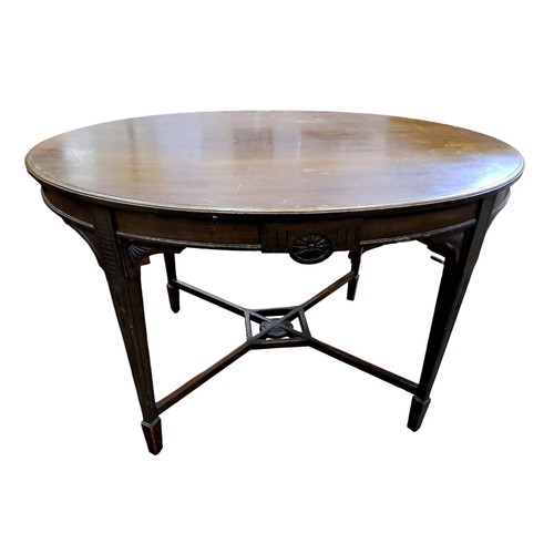 739 - A HEPPLEWHITE DESIGN MAHOGANY OCCASIONAL TABLE of oval outline the shaped top above a carved and mou... 