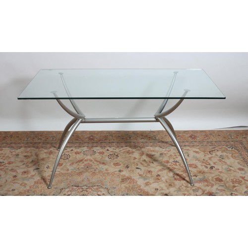 293 - A DESIGNER BEECHWOOD AND GLAZED TABLE the clear and frosted glass top raised on four chrome supports... 