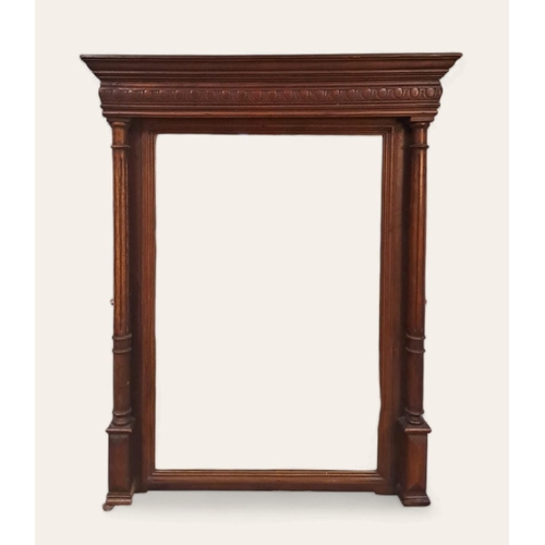 154 - A VINTAGE CONTINENTAL OAK FRAMED MIRROR the rectangular bevelled glass plate between reeded pilaster... 