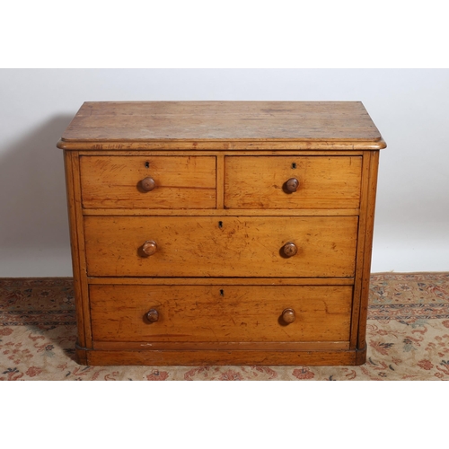 2 - A VINTAGE PINE CHEST of rectangular outline the shaped top above two short and two long drawers with... 