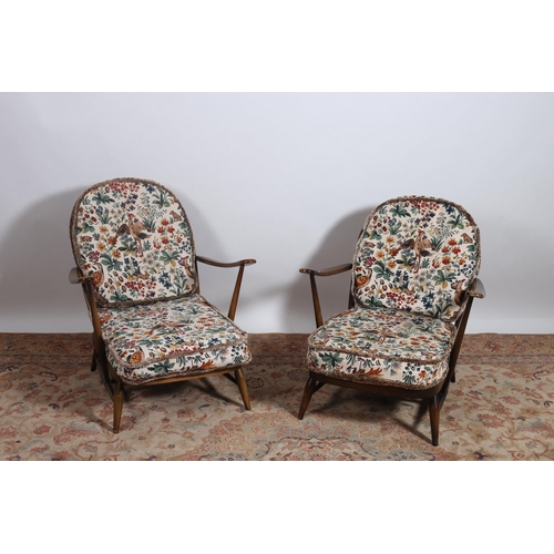 200 - A SEVEN PIECE ERCOL STYLE SUITE comprising a three seater settee with loose cushions, a set of four ... 