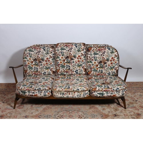 200 - A SEVEN PIECE ERCOL STYLE SUITE comprising a three seater settee with loose cushions, a set of four ... 