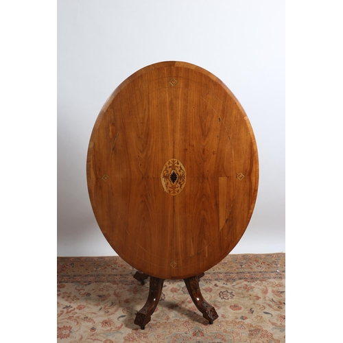 209 - AN EDWARDIAN MAHOGANY INLAID POD TABLE the oval top with inlaid panels on quadruped ring turned supp... 