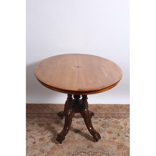 209 - AN EDWARDIAN MAHOGANY INLAID POD TABLE the oval top with inlaid panels on quadruped ring turned supp... 